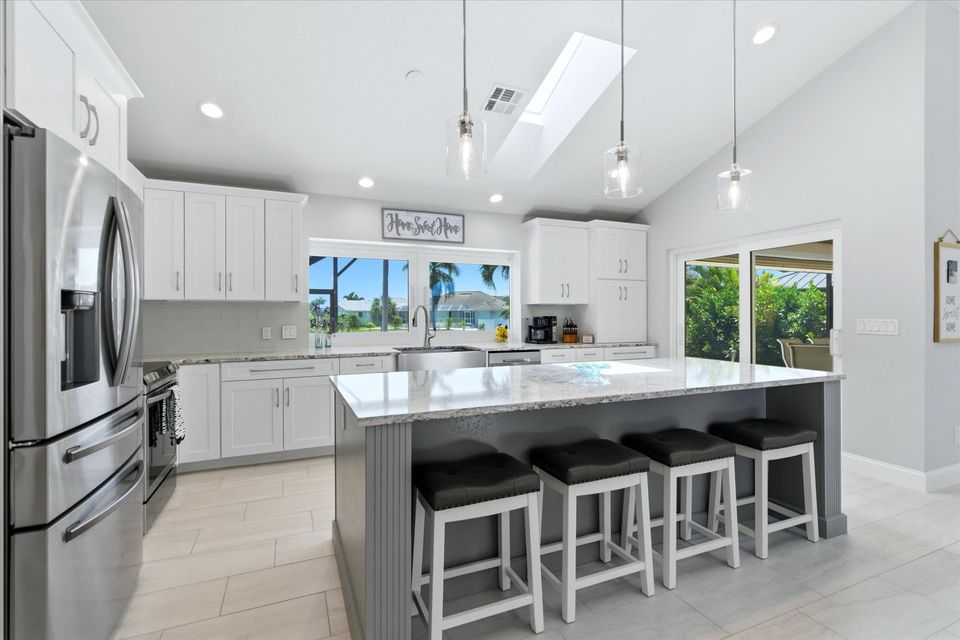 Beautiful, bright, fully-equipped kitchen with huge pass-through window