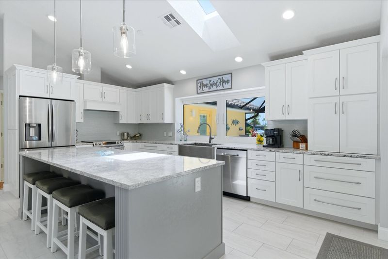 Beautiful, bright, fully-equipped kitchen with huge pass-through window