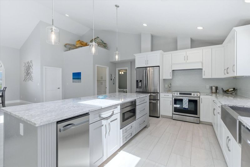 Beautiful, bright, fully-equipped kitchen with huge pass-through window