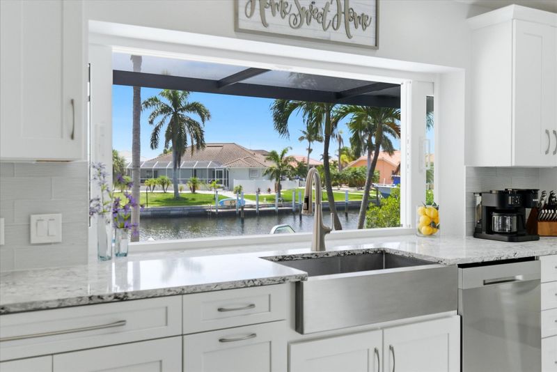 Beautiful, bright, fully-equipped kitchen with huge pass-through window