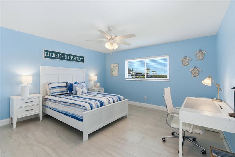 Bedroom 4 with queen bed, desk & chair, and 43" Smart TV