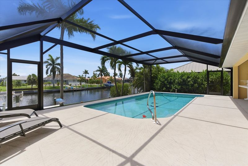 Sparkling pool overlooking the canal. Pool size: 29' x 13' x 6'D