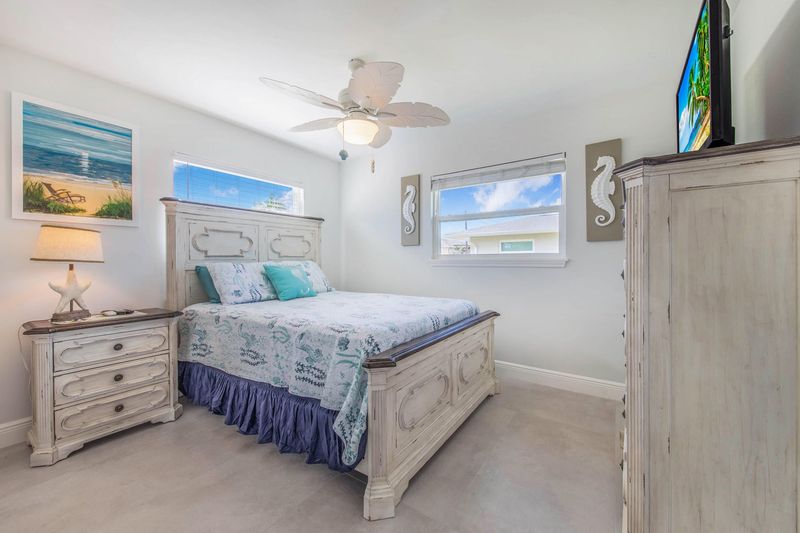 Bedroom 2 with queen bed and 39-inch Smart TV
