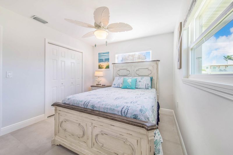 Bedroom 2 with queen bed and 39-inch Smart TV