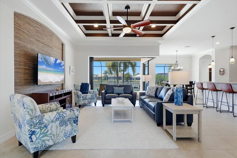 Beautiful, bright, open living space. 
Living room features ample seating