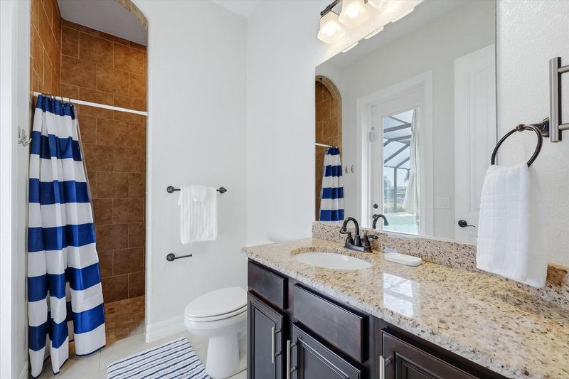 guest bathroom has a walk-in shower and lani
