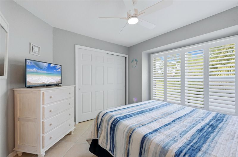 Bedroom 2 with queen bed and 32-inch Smart TV