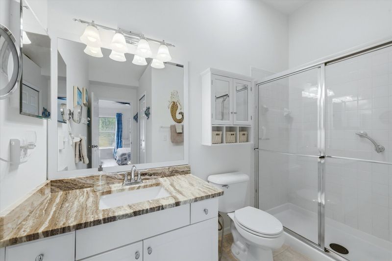 Primary attached bathroom with walk-in shower