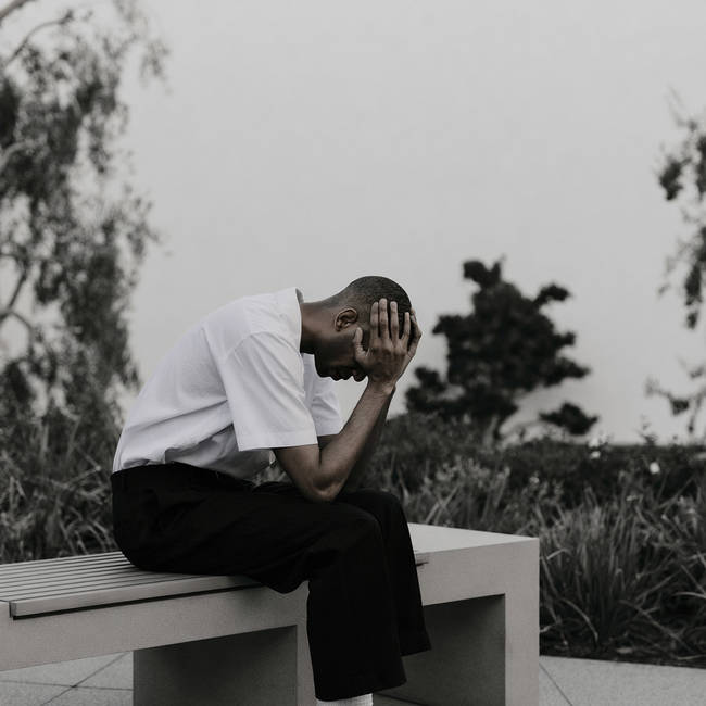 Boutee_man_with_his_head_in_his_hands