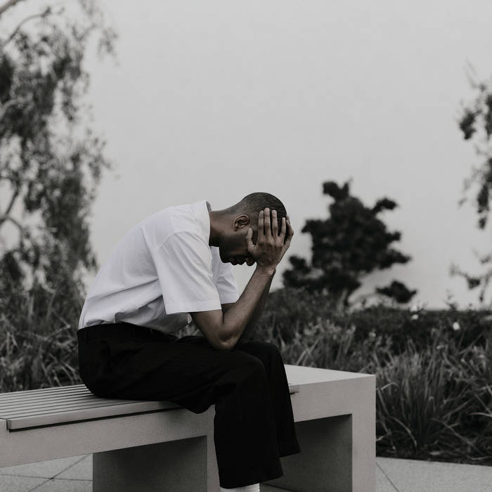 Boutee_man_with_his_head_in_his_hands