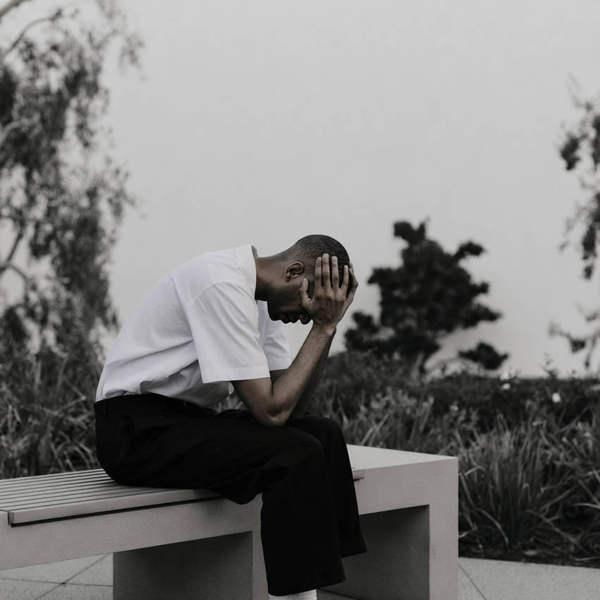 Boutee_man_with_his_head_in_his_hands
