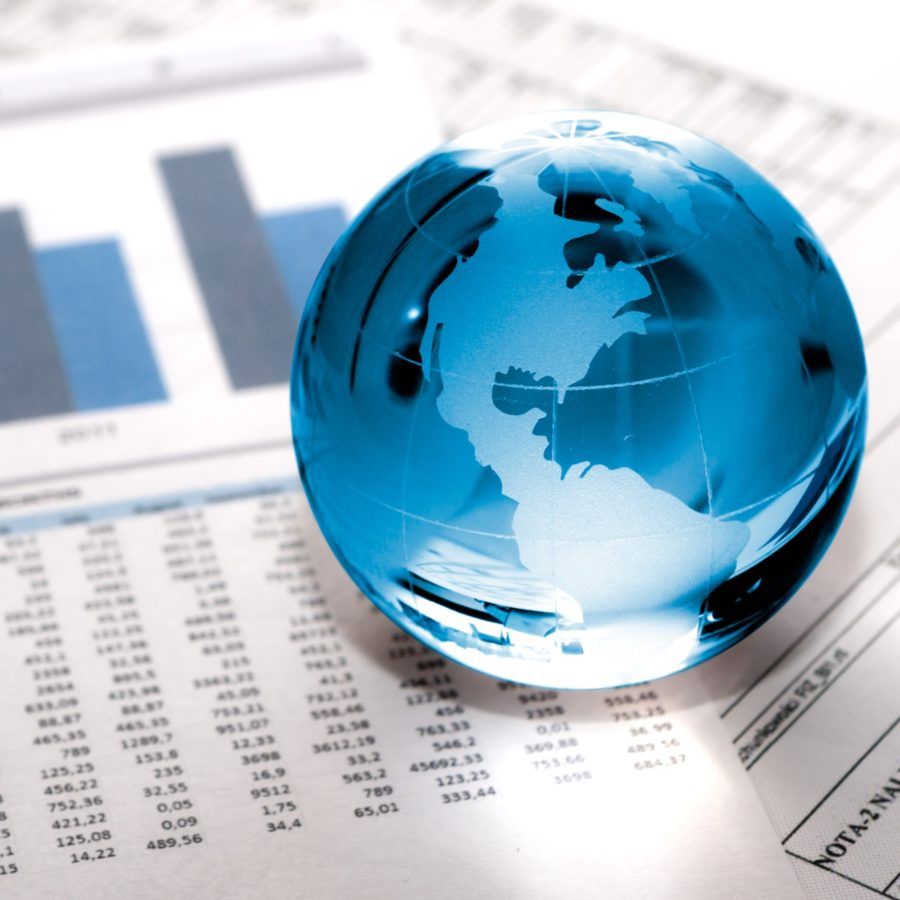 Glass globe on business oaoer