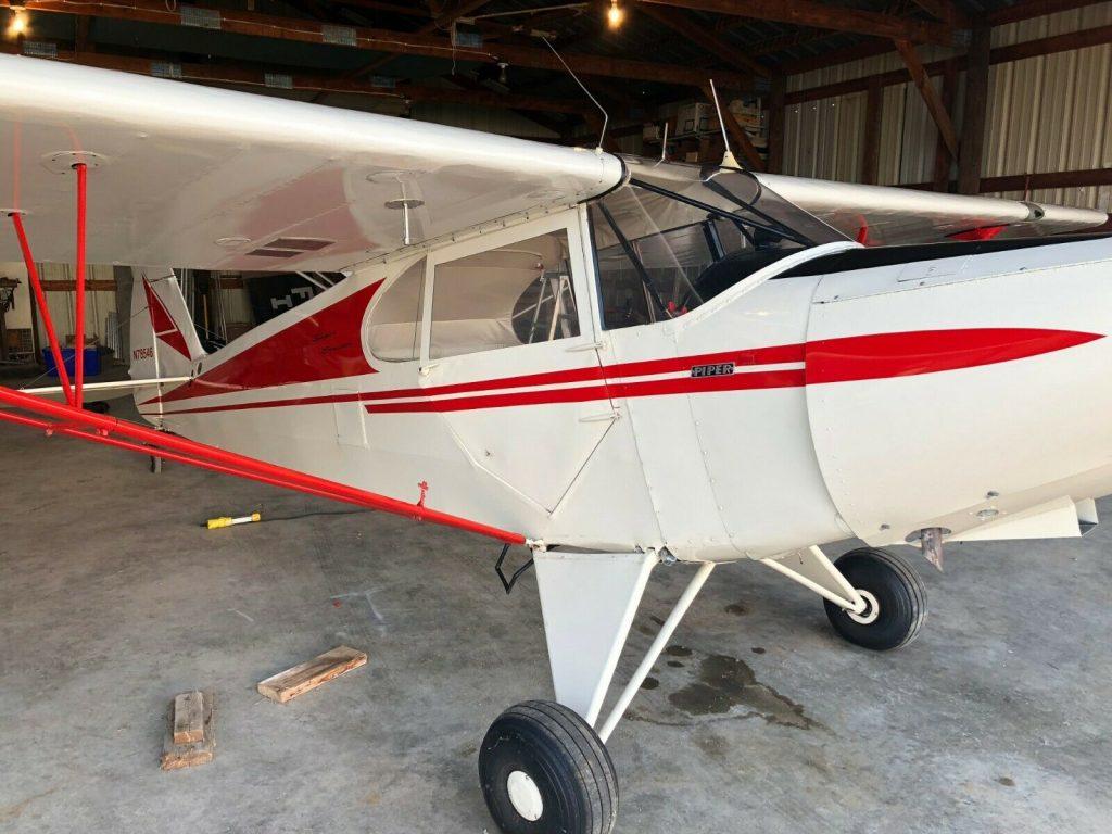 hangared 1947 Piper PA 12 Super Cruiser aircraft