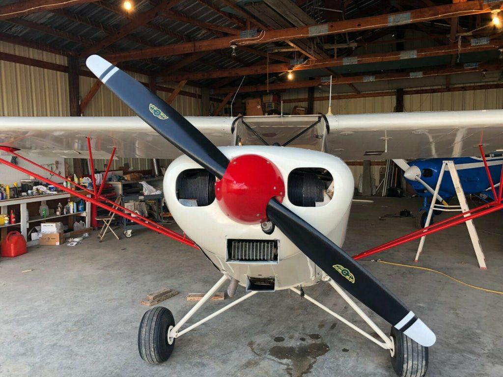 hangared 1947 Piper PA 12 Super Cruiser aircraft