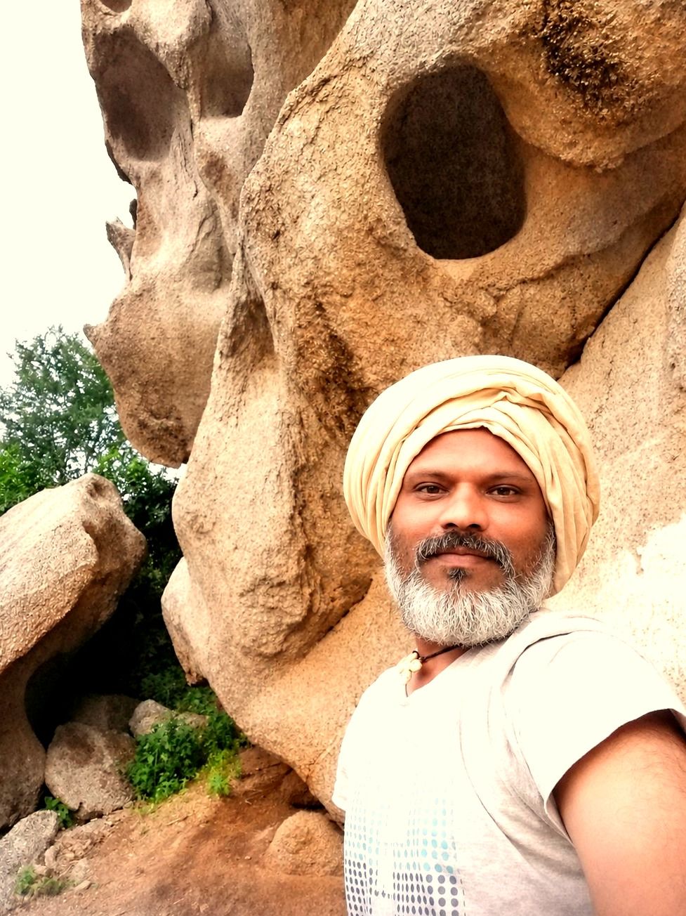 Anand Kurumbur with Sundha Mata Hills in the background
