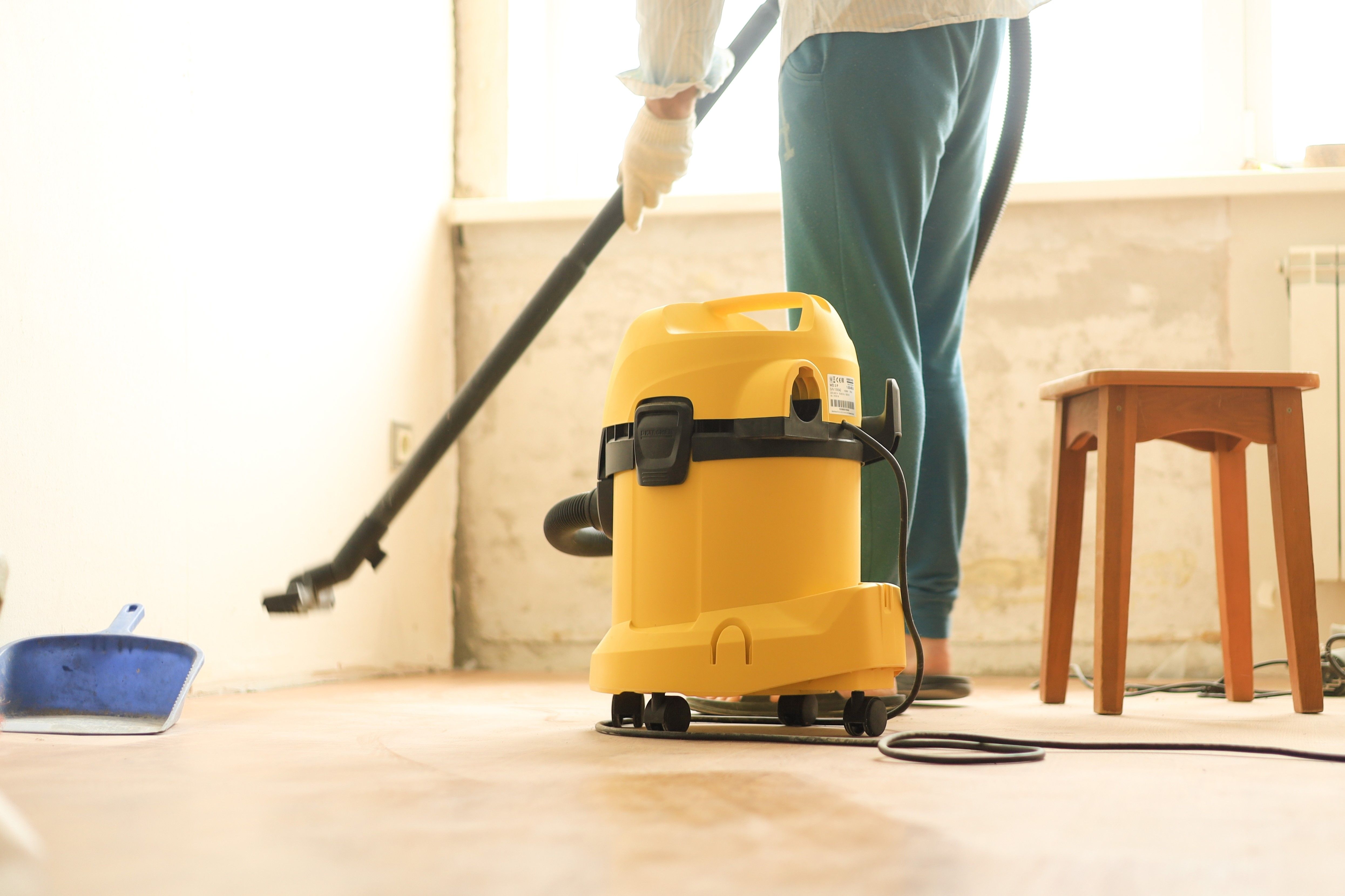 a-man-is-cleaning-the-room-during-repairs-using-a-2025-01-09-08-15-44-utc