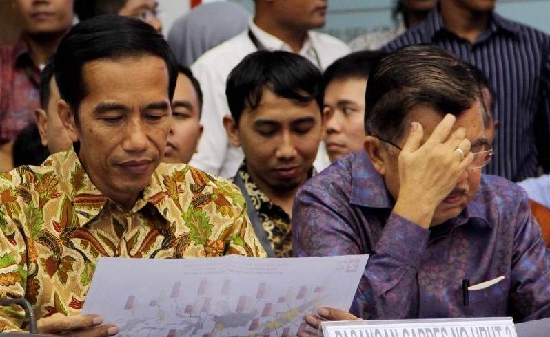 Pasangan Presiden dan Wakil Presiden Jokowi-JK tampak duduk bersandingan/Foto via okezone
