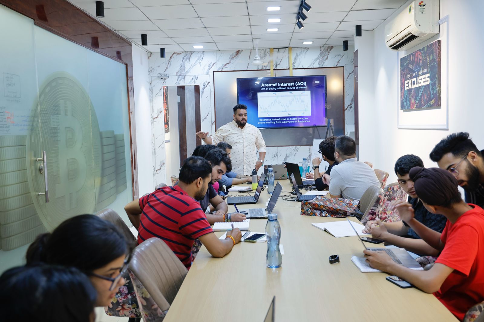 Students learning with mentors at Traderz Den Trading School