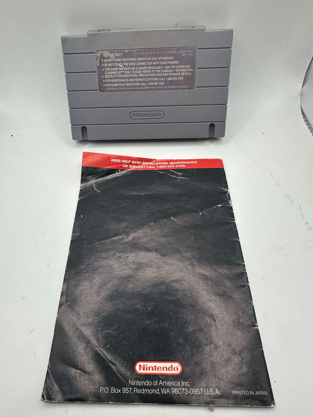 Super Nintendo Game Cartridge and Manual