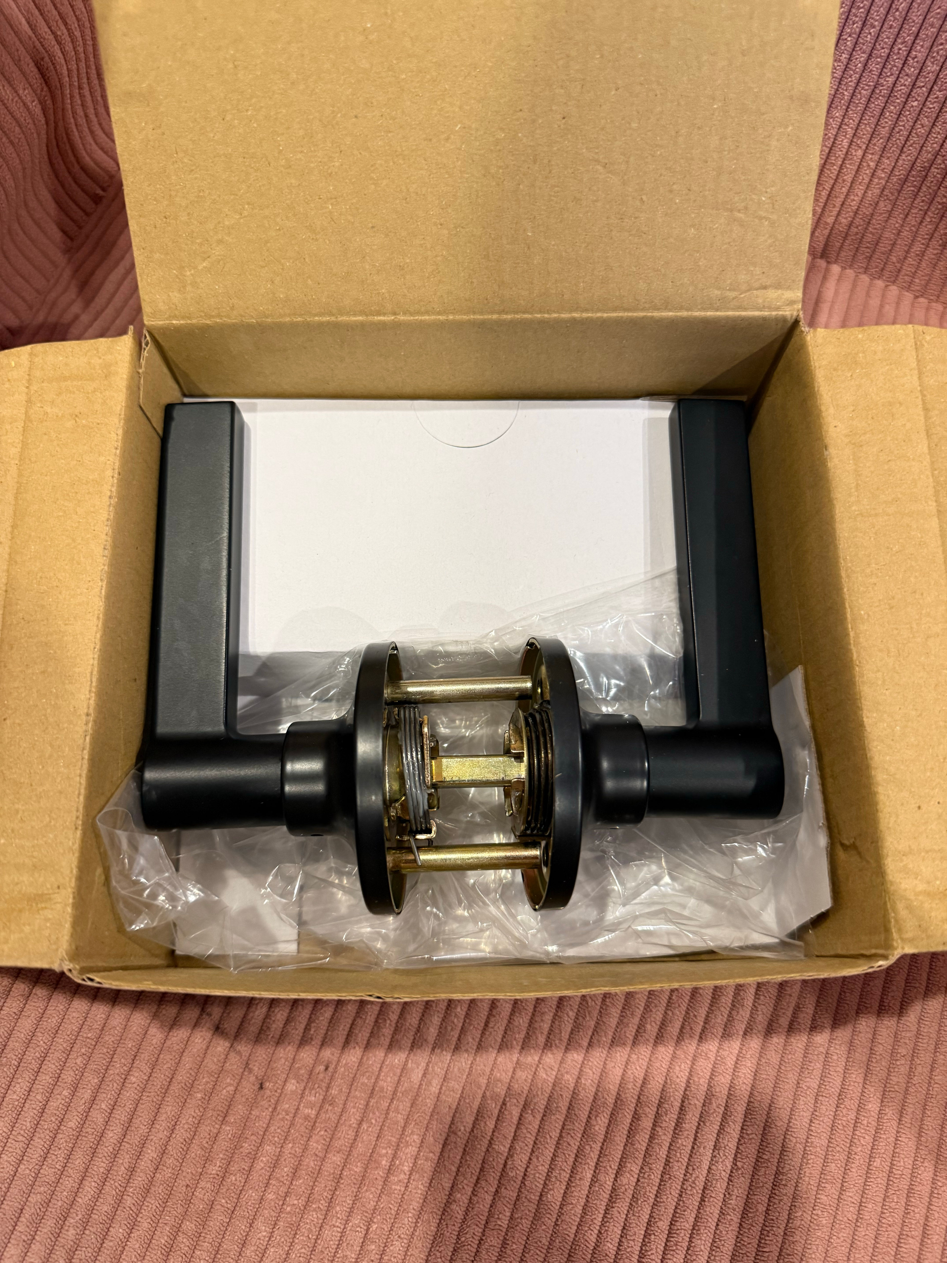 Kwikset Solstice Passage Door Lever in Matte Black