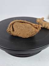 Miniature Sleeping Pig in Burlap Sack Figurine - Image 1
