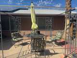 Metal Patio Dining Set with Cushions and Umbrella - Image 4