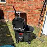 Rubbermaid WaveBrake 35 Qt Black Side-Press Mop Bucket with Wringer - Image 1