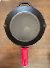 Lodge Cast Iron Skillet with Red Silicone Handle 10.25" - Image 1