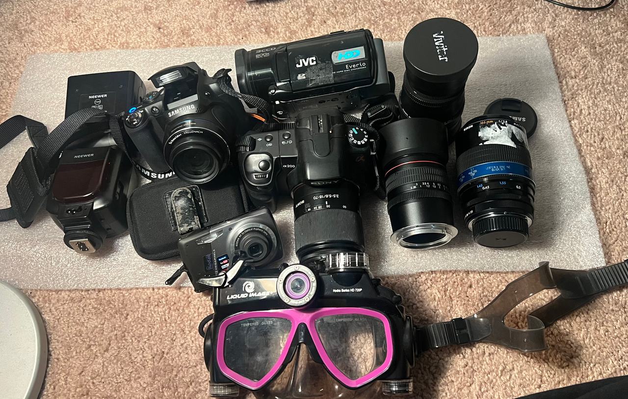 Sony Alpha DSLR-A200 camera lot Samsung lenses liquid image jvc camcorder