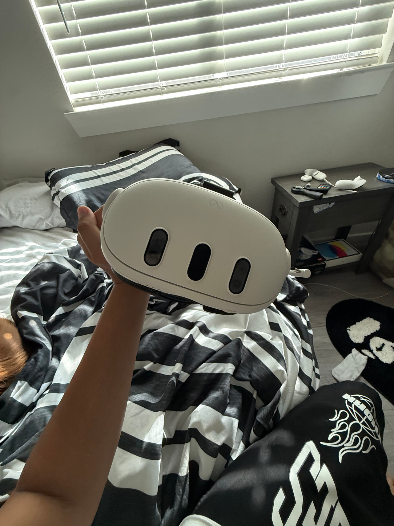 Meta Quest 3 With 2 controlled and a Kiwi head strap