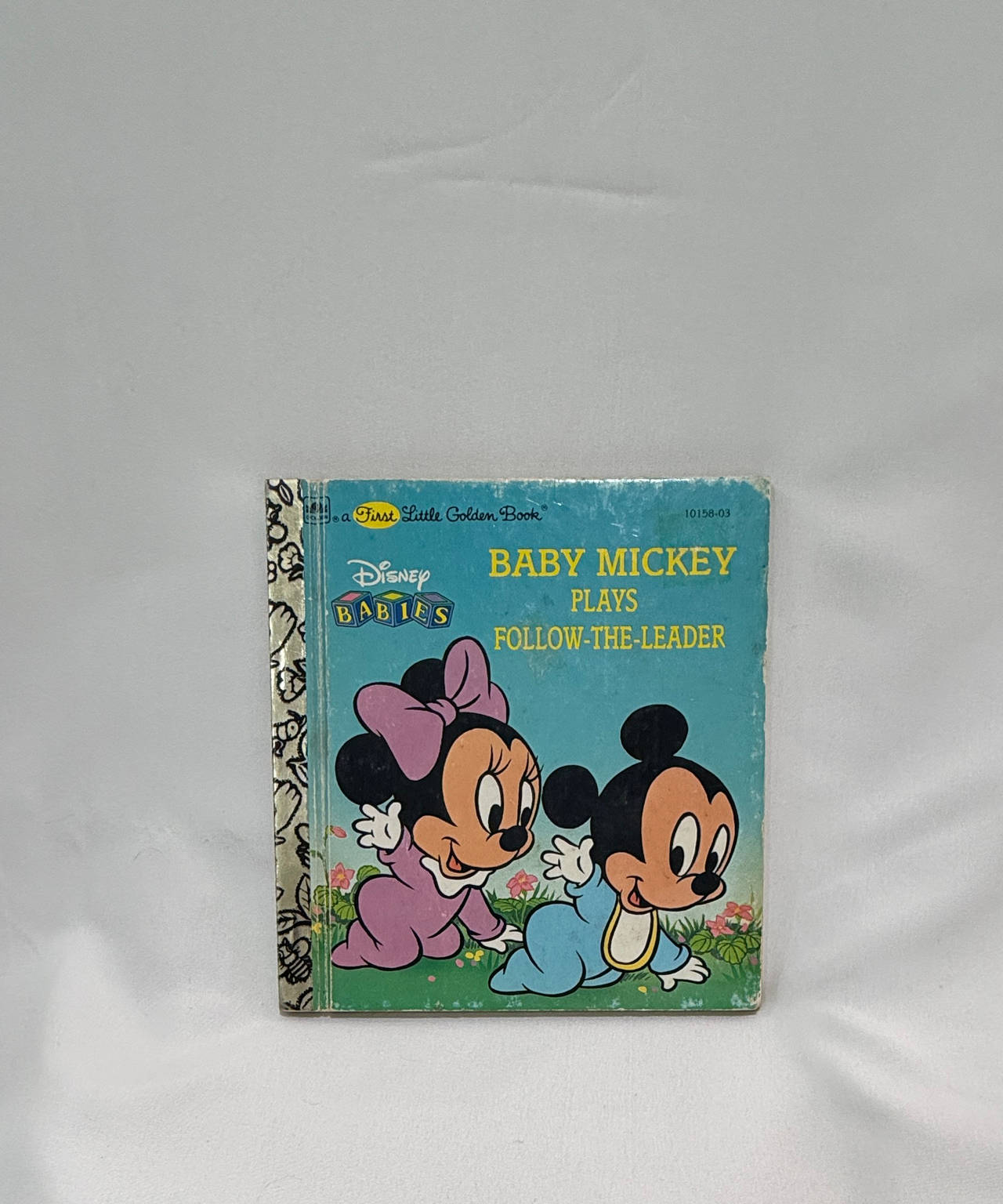 Disney Babies - Baby Mickey Plays Follow-the-Leader (A First Little Golden Book)