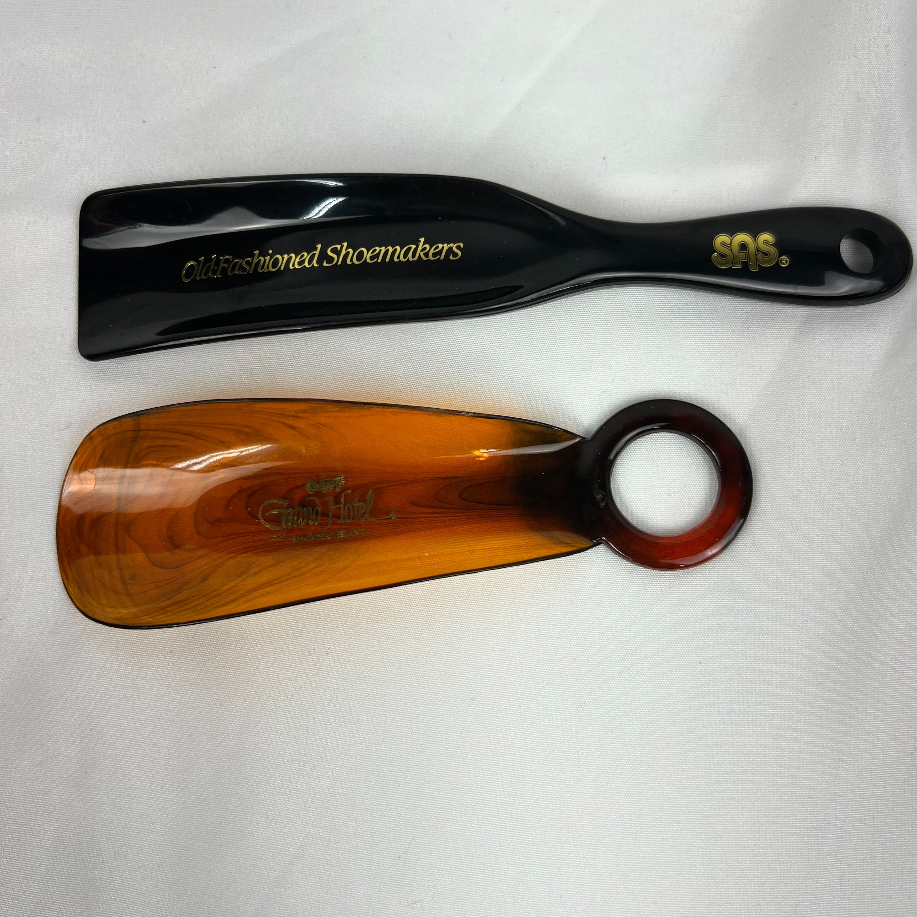 Vintage Shoe Horn Lot of 2 Acrylic SAS Old Fashioned Shoemakers Grand Hotel