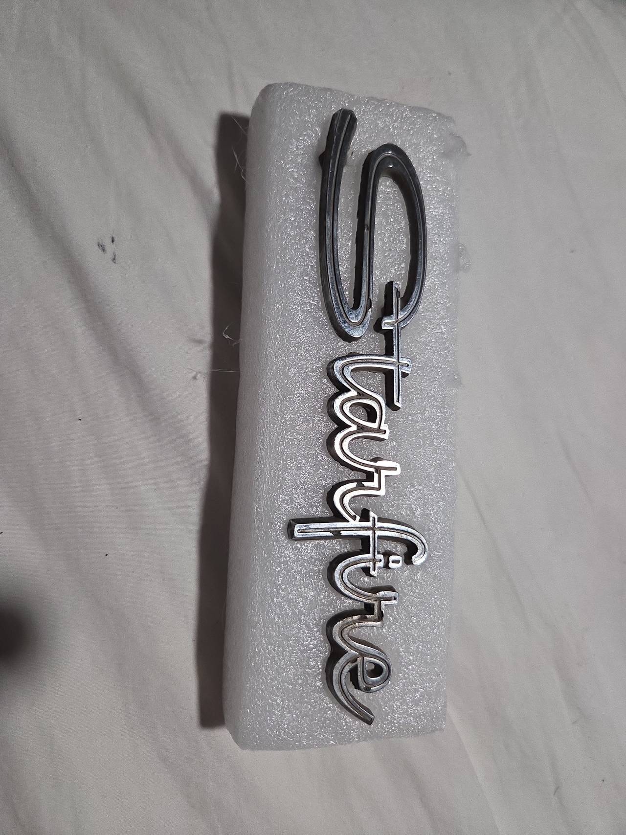 Oldsmobile Starfire Script Emblem