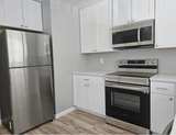 Samsung 15.6 cu ft Top Freezer Refrigerator Stainless Steel - Image 5