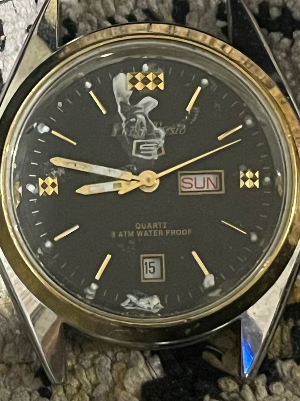 Seiko Men's Gold Tone Watch with Black Dial