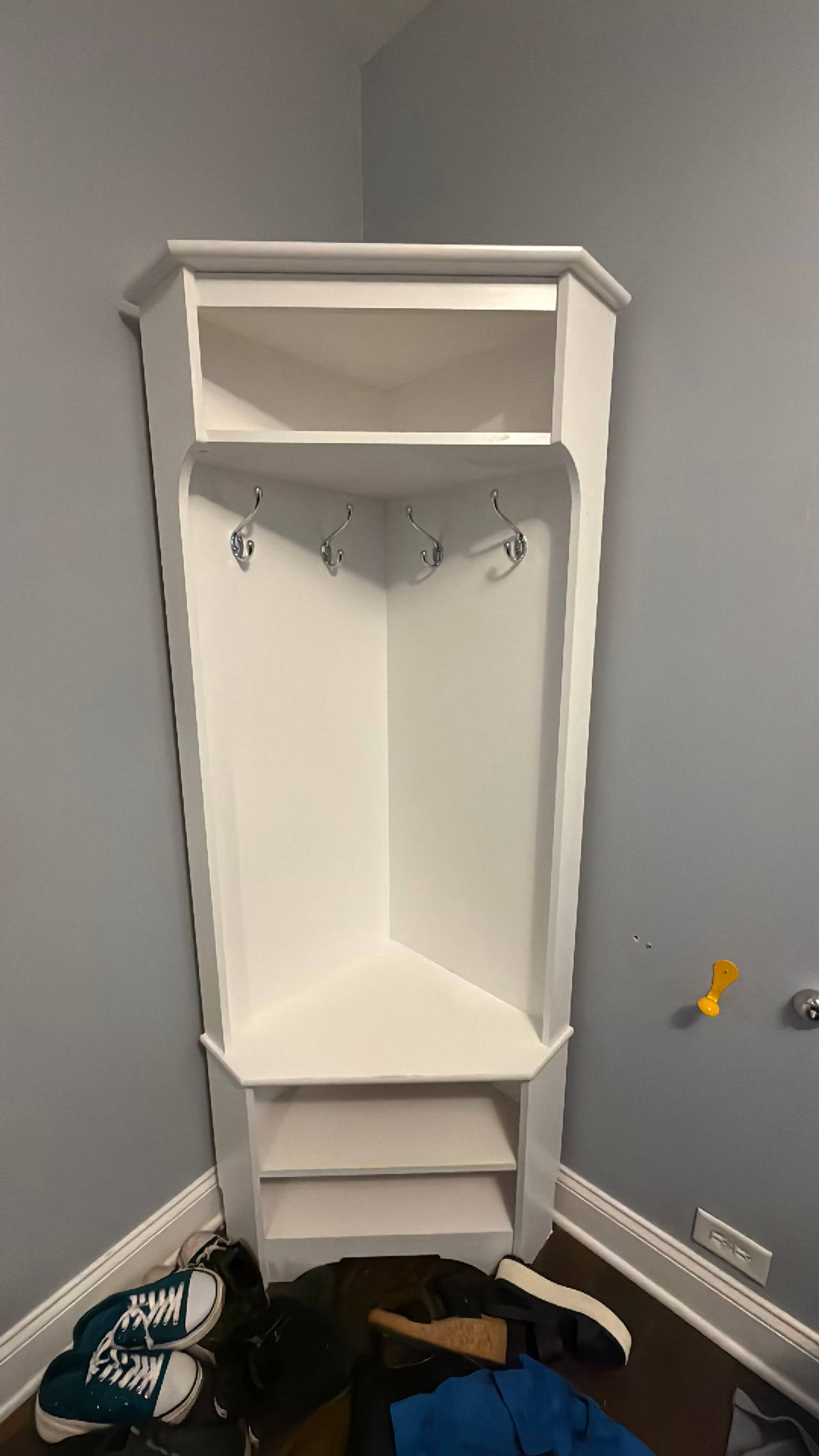 White corner coat and shoe storage. Used but in great shape. 