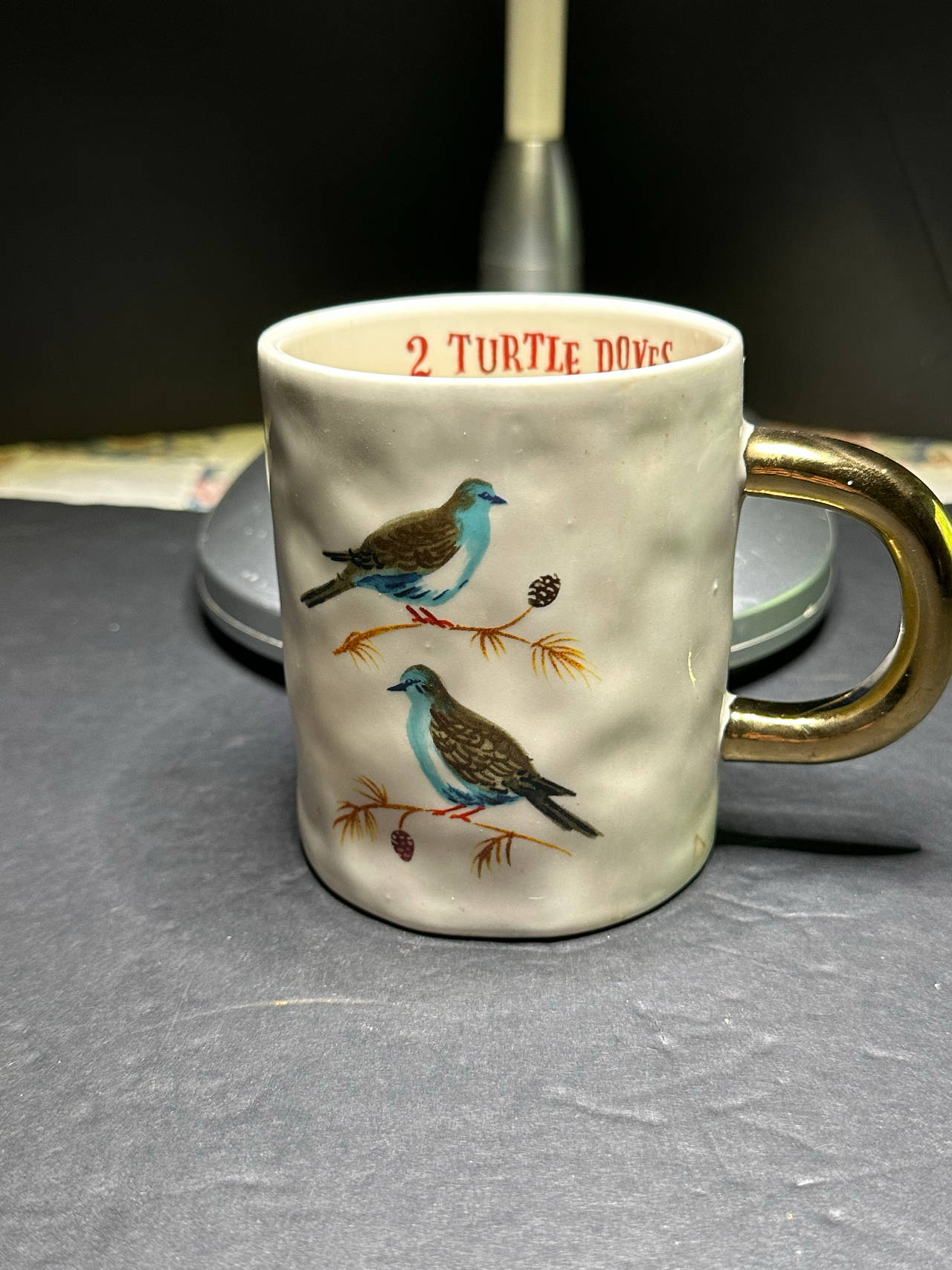Magenta brand Angela Staehling Booville Christmas coffee mug with a gold handle