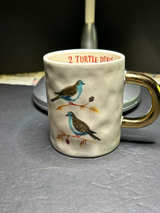 Magenta brand Angela Staehling Booville Christmas coffee mug with a gold handle - Image 1
