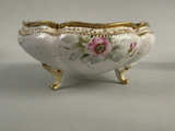 A hand-painted Nippon porcelain footed bowl with floral motifs and gold trim. - Image 1