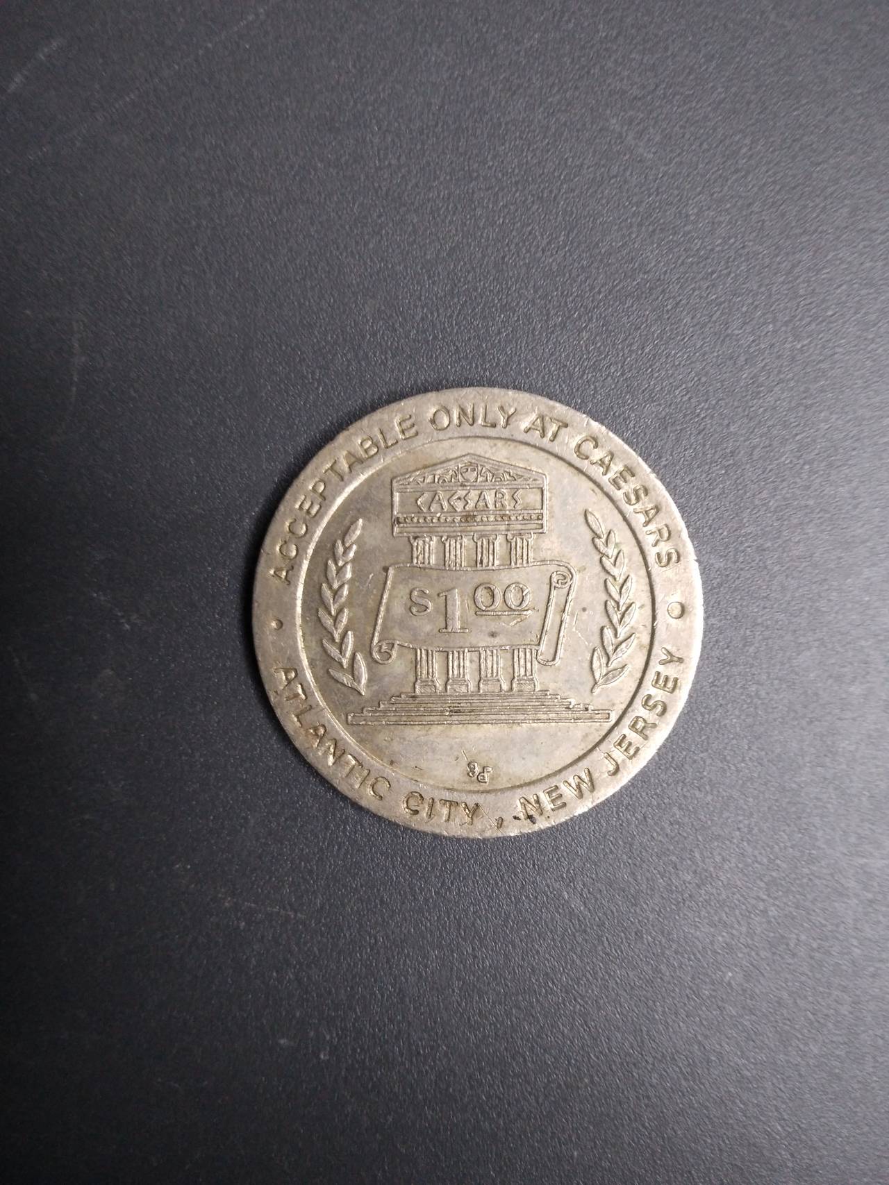 Caesars Palace One Dollar Gaming Token