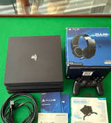 Sony PlayStation 4 Pro 1TB Bundle with Pulse Headset & Strike Pack - Image 1