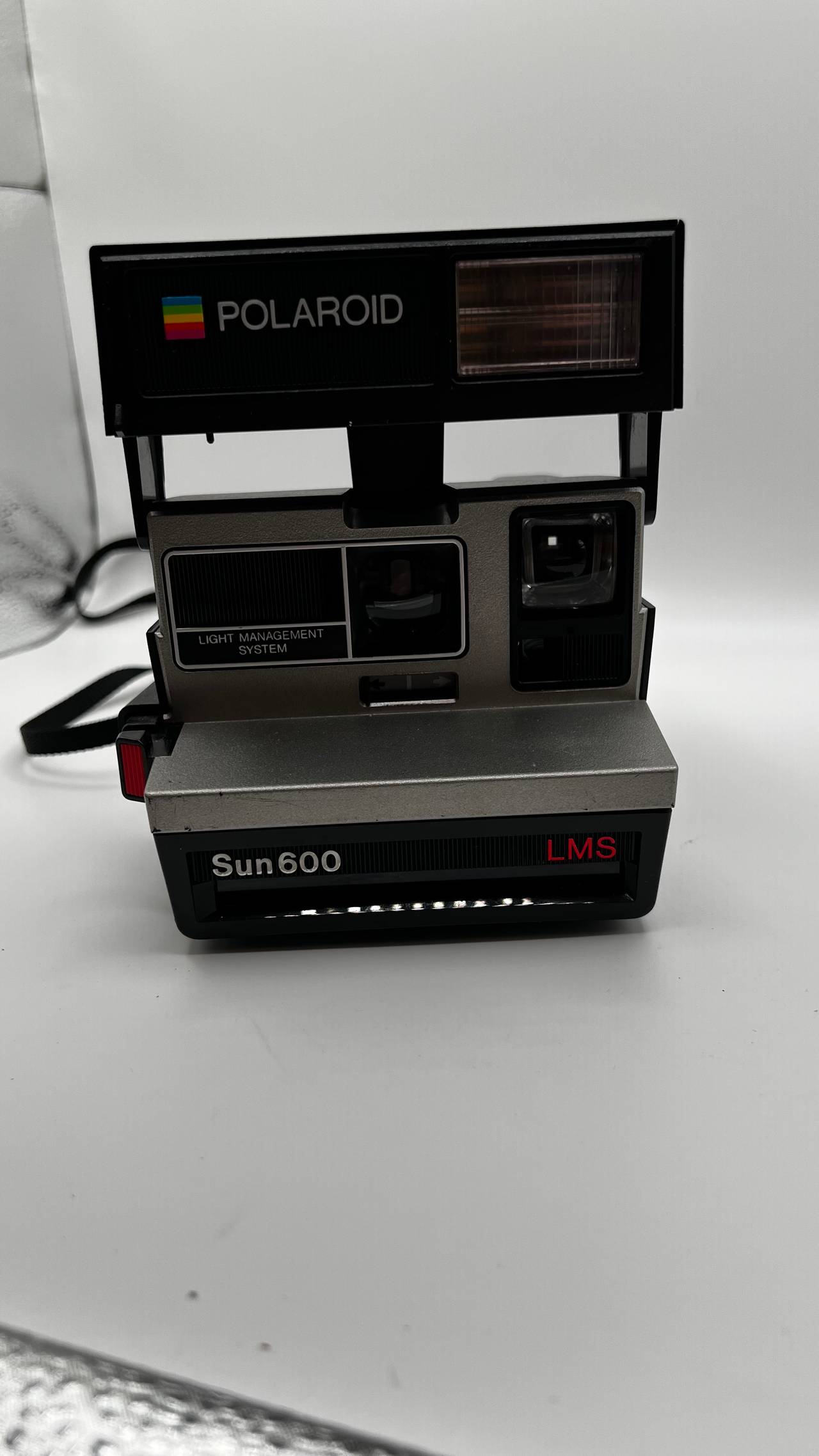 Polaroid Sun 600 LMS Black Instant Film Camera with Strap, untested. 