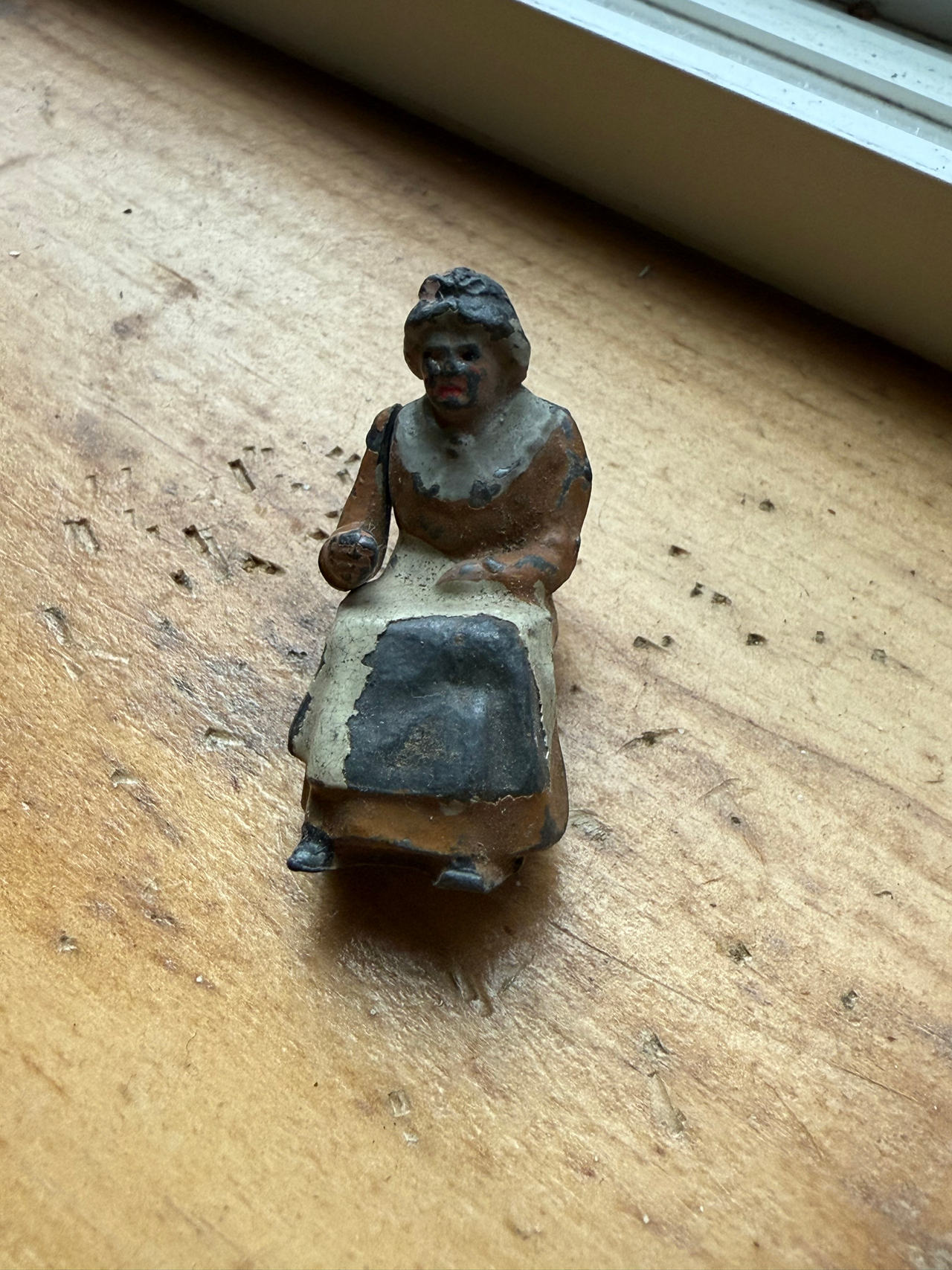 Antique Hubley Cast Iron Seated Woman Figure