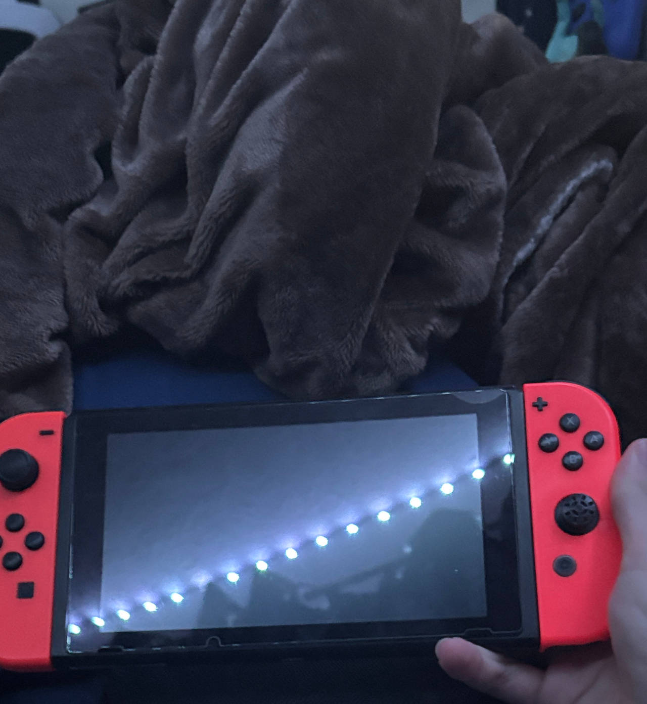Nintendo Switch with Neon Blue and Neon Red Joy-Con