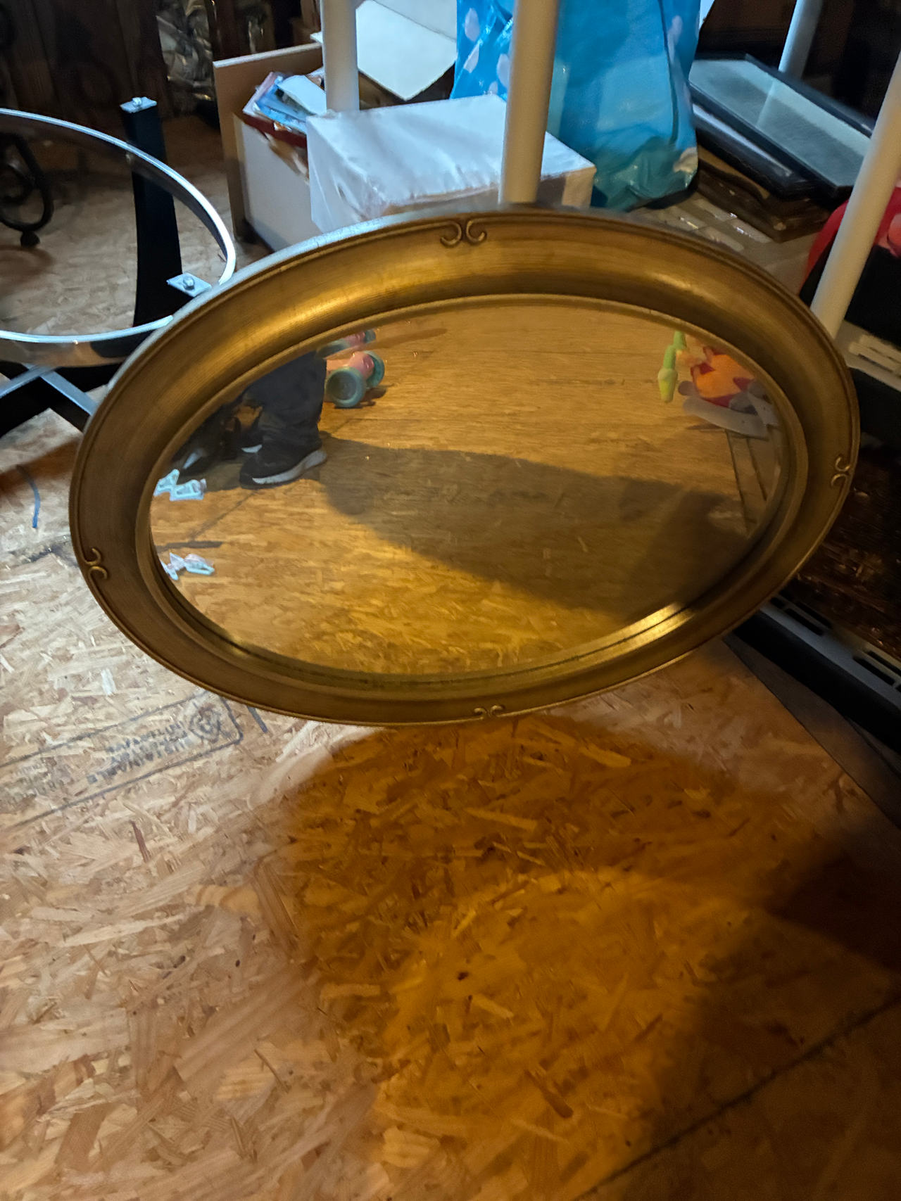 Oval Gold Framed Wall Mirror with Decorative Accents