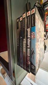 PlayStation 2 Slim with cables, controller, 16MB memory card, and some games.  - Image 2