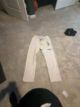 Fear of God Essentials Light Oatmeal Relaxed Sweatpants - Image 1