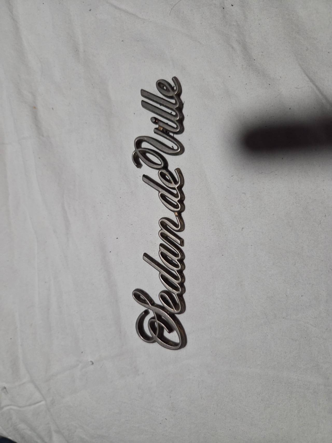 Cadillac Sedan de Ville Script Emblem