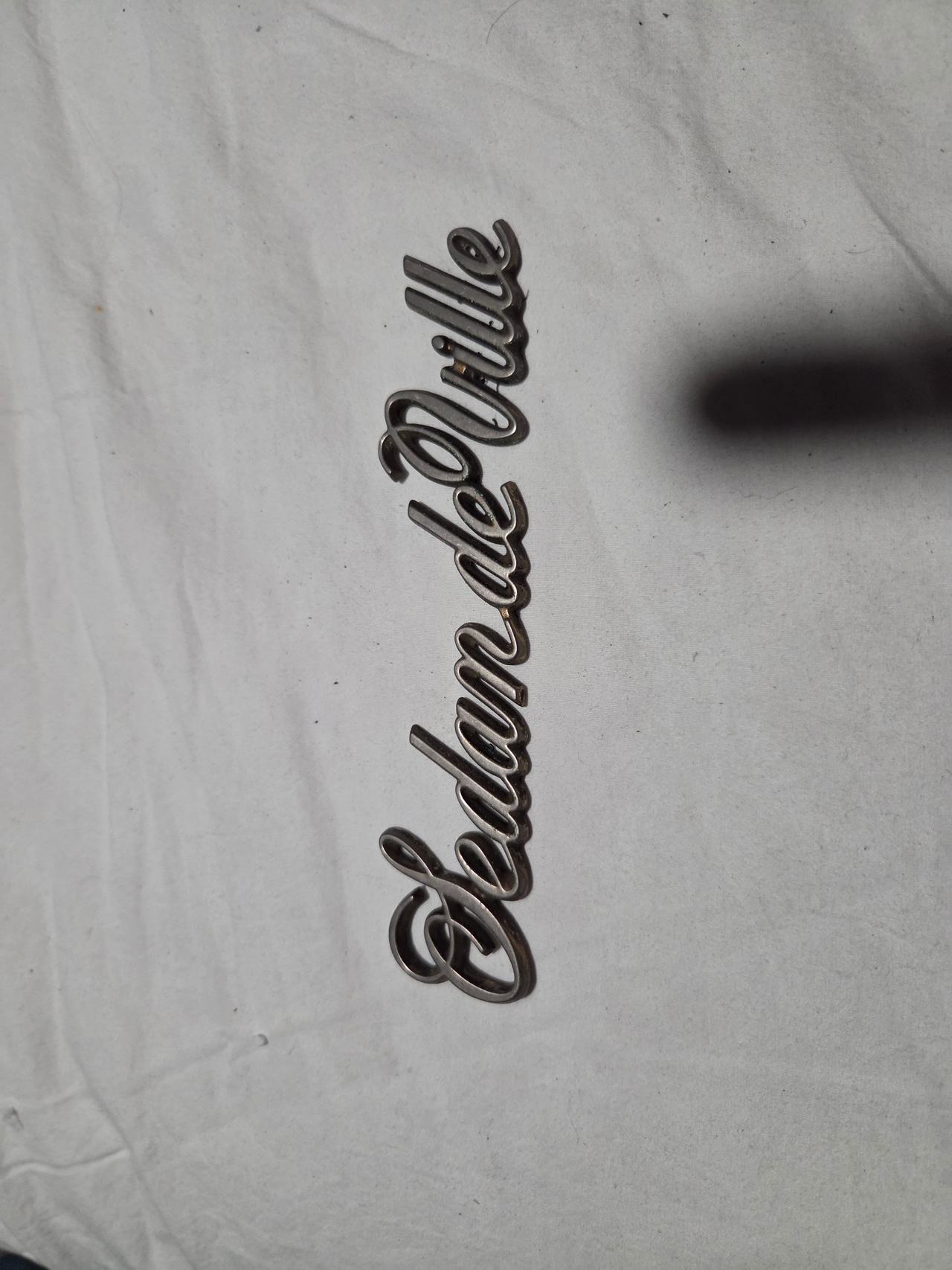 Cadillac Sedan de Ville Script Emblem