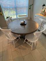 Living Spaces Round Wooden Dining Table with White Spindle Back Chairs - Image 4